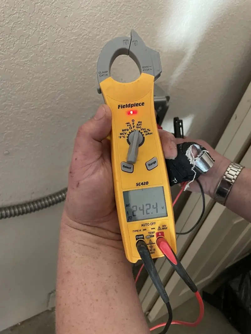 Voltage testing with clamp meter during Aluminum Wiring Replacement in Ada